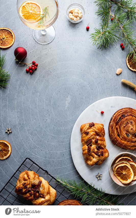 Delicious baked pastries with Christmas decoration food pastry plait sweet roll plate christmas homemade pine tree tradition arrangement cuisine table dessert