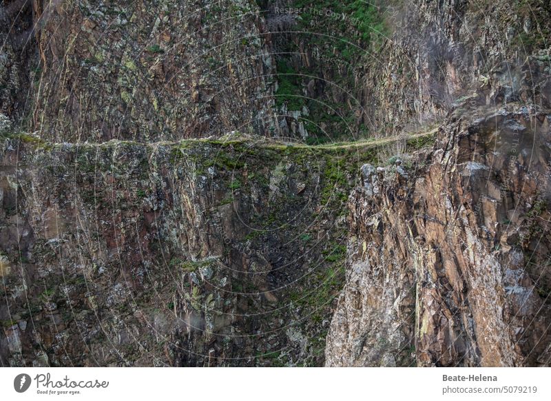 Very close to the abyss Wall of rock stone bathroom stone cathedral Rock path Dangerous Climbing wall challenge Stone Landscape Nature Exterior shot Deserted