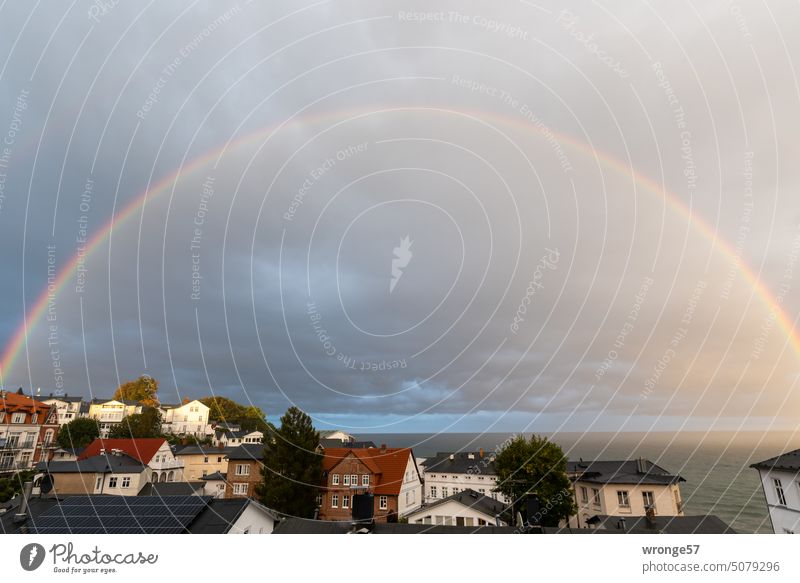 Rainbow over the sea Ocean Baltic Sea Sassnitz Rügen Rainy weather Autumn houses Old town Horizon Rain Cloud Remote View Sky Exterior shot Vacation & Travel