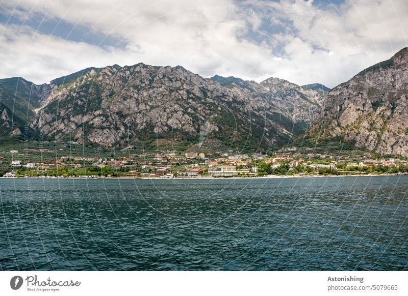 View of Limone sul Garda, Lake Garda, Italy Lemone bank coast mountain Tall height Water Town Steep Large Horizon Clouds Sky Vantage point wave Blue Green