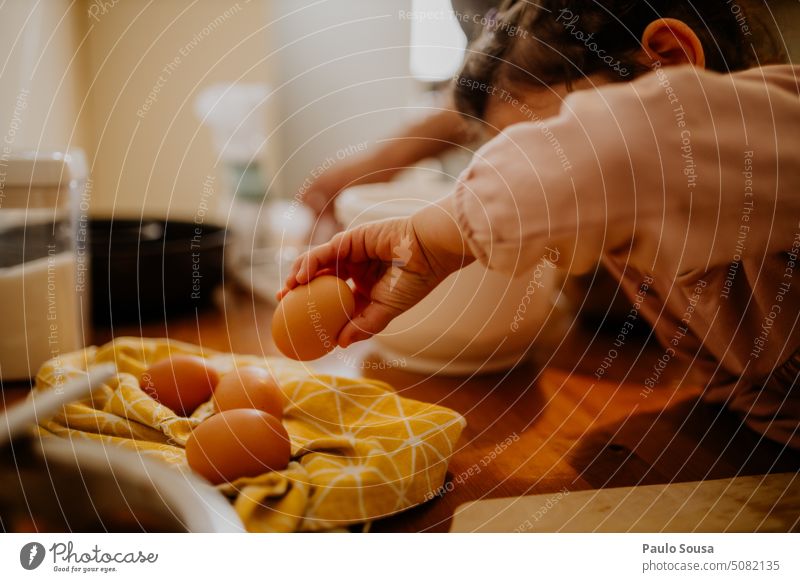 Child picking eggs childhood Egg Cooking Preparation Baked goods home recipe fun cook cooking food Kitchen Authentic Bakery Dough Table Make Flour Baking