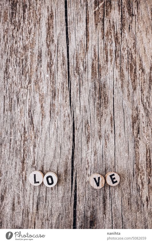 Love message against an old wooden texture love background vertical empty space negative aged brown letter designt broke broken grain vintage retro surface