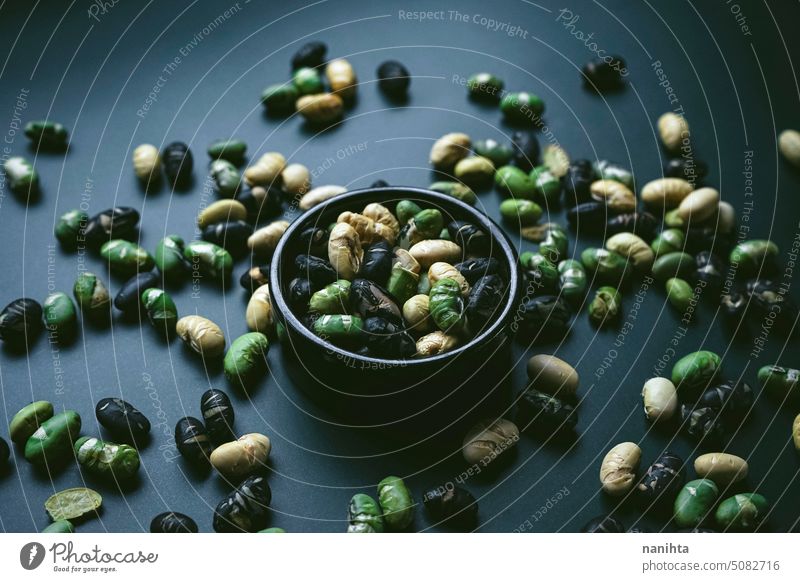 Elegant flat lay in dark tones of three color roasted edamame soya gourmet background minimal minimalistic flatlay pattern food texture mood elegant elegance