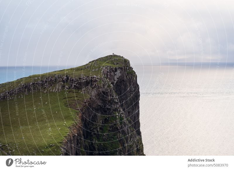 People admiring sea from cliff people rocky admire endless nature landscape mountain hill female scotland europe uk united kingdom warm clothes outerwear travel