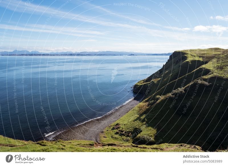 Picturesque view of cliff near blue sea scenery ripple seashore blue sky wave water tourism nature skye island scotland europe seascape breathtaking spectacular