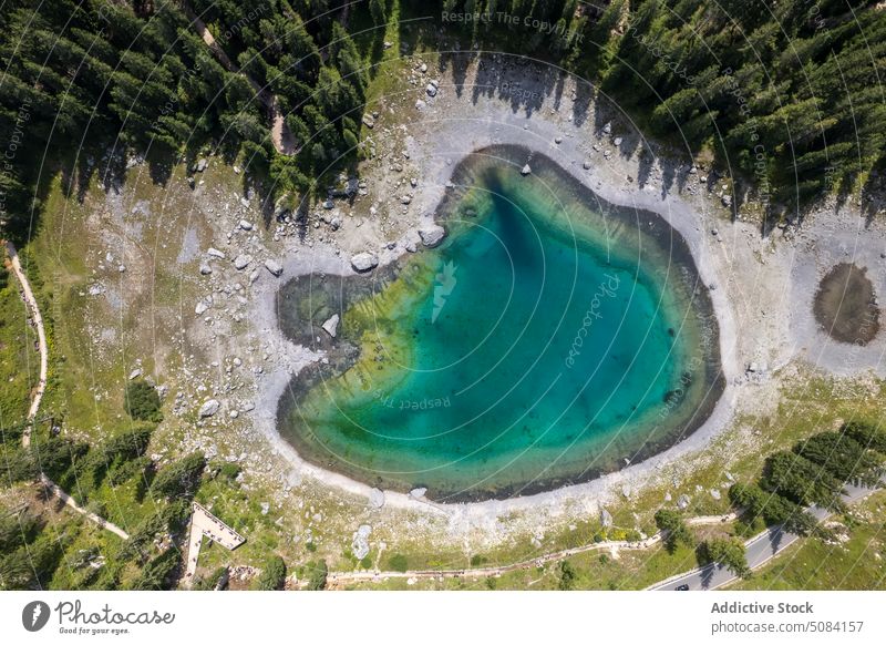 Picturesque view of lake surrounded by forest scenery landscape nature water tree greenery woods tourism karersee dolomites italy europe picturesque scenic