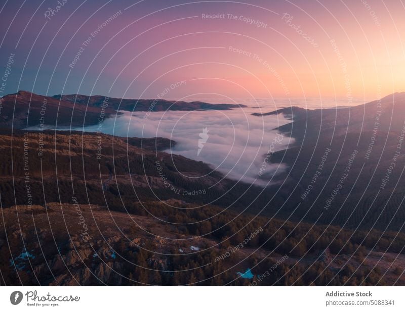 High mountain range in mist in sunset ridge high cloud fog colorful nature landscape scenery majestic environment valley sky puerto de la puebla sierra norte