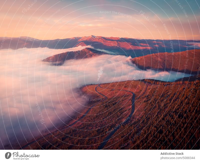 High mountain range in mist in sunset ridge high cloud fog colorful nature landscape scenery majestic environment valley sky puerto de la puebla sierra norte