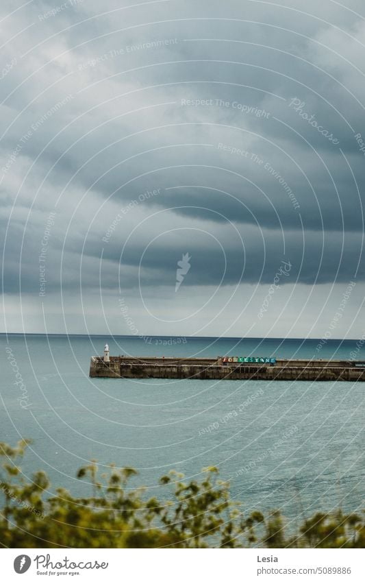 Storm cloudy Storm warning wather seaside sky clouds sky bed rainy Rain Rainy weather Rain on the sea Lighthouse Light blue Bridge bridges Sea bridge sea blue