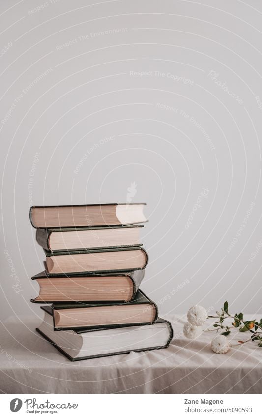 Stacked old books pile of books stacked books book aesthetic reading romantic reading reading books feminine lifestyle minimal cottagecore neutral