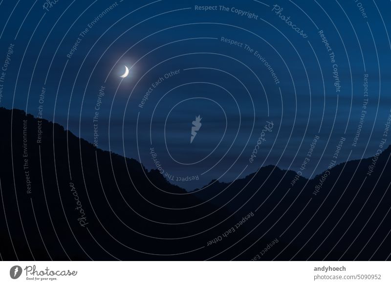 The waxing moon over the mountains of the serra de tramuntana abstract astronomy black bright cater celebration celestial circle copy space crescent dark