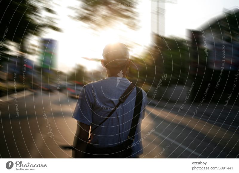 Motion blur of person riding bicycle on city street. rear view. man bike road outdoor ride male sport speed cyclist lifestyle transport motion healthy asian