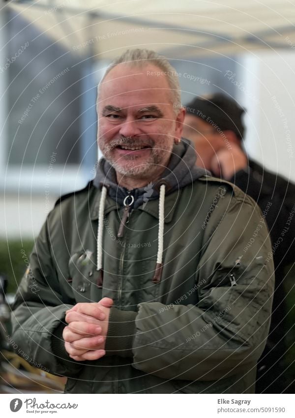 Young man looking happily at camera Man Only one man Adults Exterior shot One young adult man Human being 1 Person Individual Day Colour photo