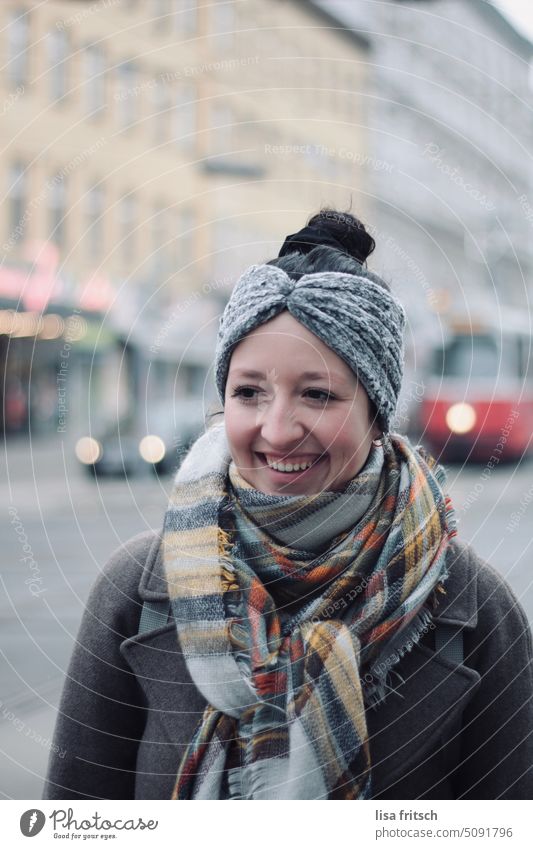 WINTER - COLD - CITY - WOMAN - BEAUTIFUL Woman Chignon Headband Scarf Winter chill Town Transport Adults Colour photo Exterior shot portrait pretty Young woman