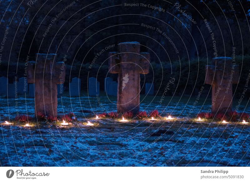 Stone crosses in the blue hour with candlelight as a memorial Kreus Memory Death Grief Cemetery Sadness Exterior shot Calm Transience Religion and faith Grave