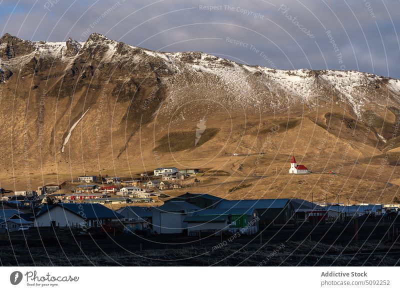 Small village near snowy mountain reynisdrangar house winter landscape nature settlement vik countryside weather iceland picturesque cold scenic small scenery