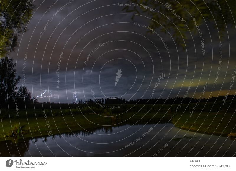 Thunderstorm on the lake abstraction background backgrounds blindness bright cloud clouds dusk electricity energy evening fire flash force hit hurricane kick