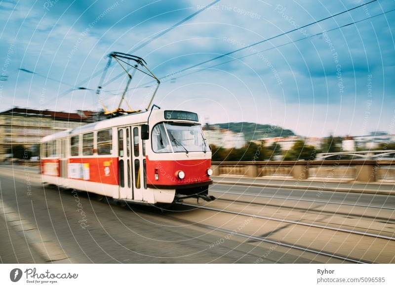 Prague, Czech Republic. Public Old Retro Tram Moving On Bridge In Blurred Motion european capital road town blurred motion drive prague number urban tramway