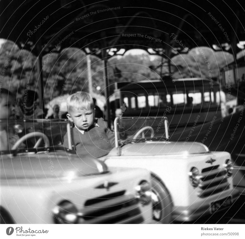 shooting match Merry-go-round Child Village Carousel Fairs & Carnivals Shooting match Event The fifties Joy Leisure and hobbies Boy (child) Bus