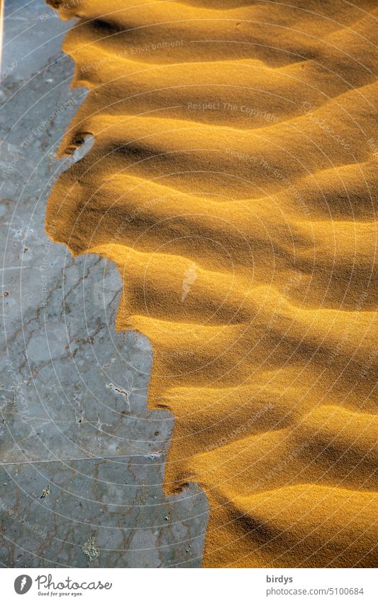 Blown sand on a stone floor.surreal, book cover Sand wavy Stone floor Pattern Structures and shapes Drift Line Marble floor Abstract Background picture Design