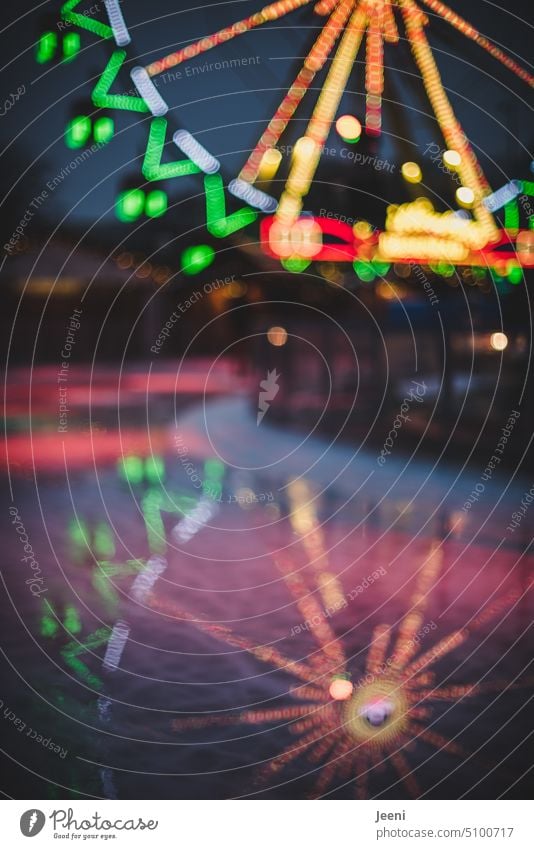 Ferris wheel with mirror image Reflection Christmas & Advent Christmas Fair Winter Ice Frozen surface Ice-skating Light colored variegated Evening Dark