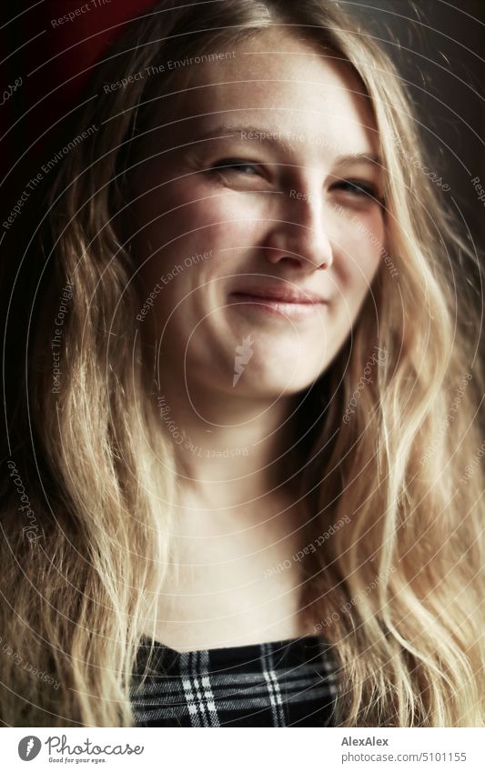 Close portrait of young blonde woman standing at window smiling Woman Young woman Blonde Long-haired Smiling Joy Window Slim kind Pleasant pretty Attractive