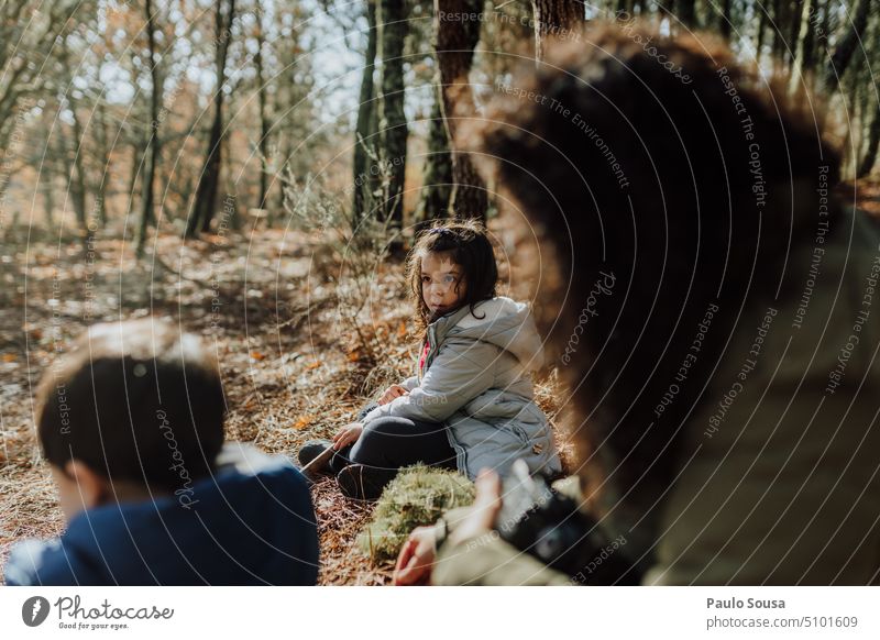 Cute child with family in the forest Girl Child 3 - 8 years Family & Relations Parenting parent Forest Sit sitting Resting Hiking Nature travel Authentic