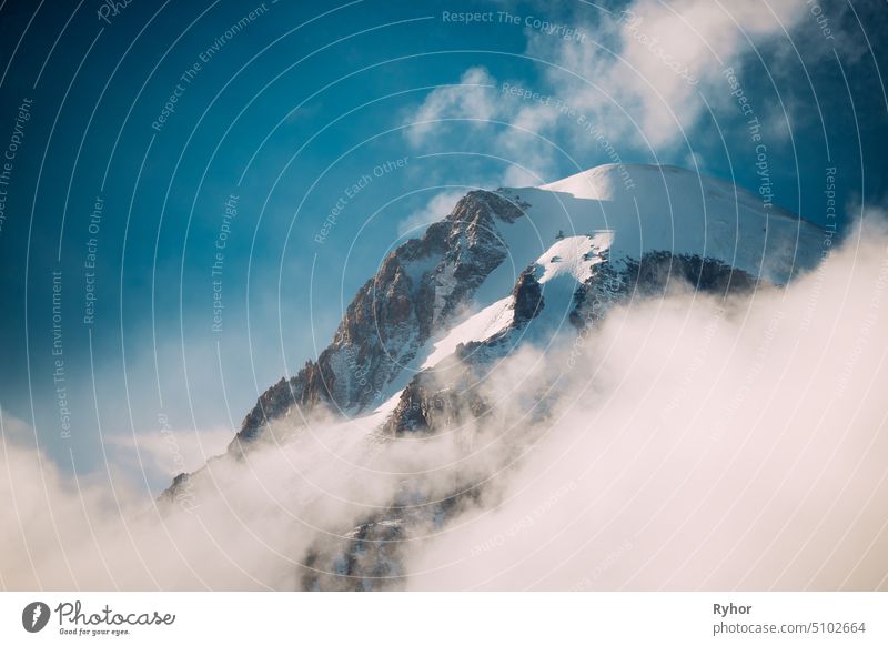 Georgia. Peak Of Mount Kazbek Covered With Snow. Kazbek Is A Stratovolcano And One Of Major Mountains Of Caucasus. Beautiful Georgian Nature Landscape In Early Winter.