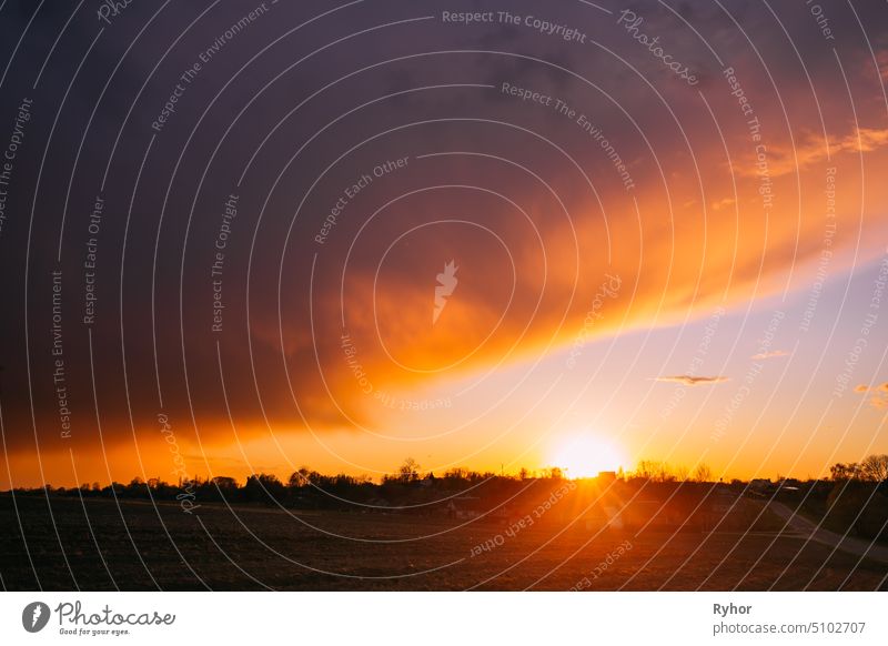 Spring Sunset Sunrise Above Belarusian Village In Eastern Europe. Belarusian House In Village Or Countryside Of Belarus In Summer Sunny Evening sunlight