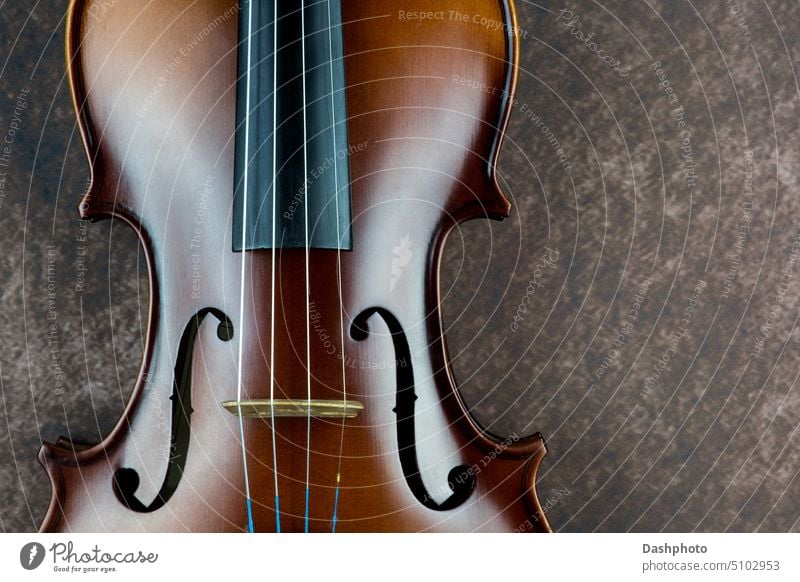 Violin Body Closeup on a Mottled Background violin instrument music musical string instrument musical instrument wood wooden timber orchestra orchestral