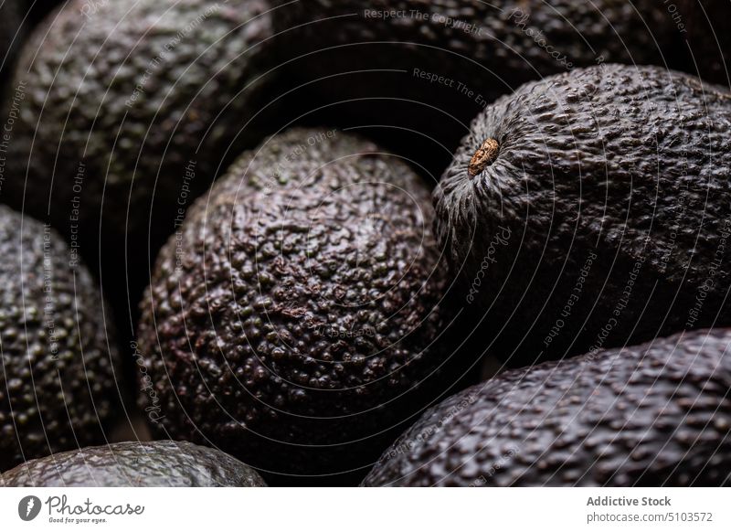 Ripe dark avocados as background whole fruit delicious assorted many taste grocery vegetarian healthy food organic fresh meal palatable diet ripe raw minimal