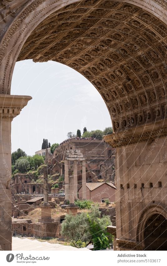 Old buildings behind triumphal arch old square historic architecture landmark monument heritage rome italy arch of septimius severus roman forum famous antique