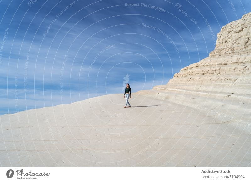 Woman walking on white rocky cliff near sea woman traveler journey tourism nature scala dei turchi agrigento sicily italy europe scenic picturesque tourist