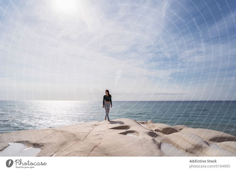 Woman standing on white rocky cliff near sea woman traveler ripple water journey tourism nature scala dei turchi agrigento sicily italy europe scenic