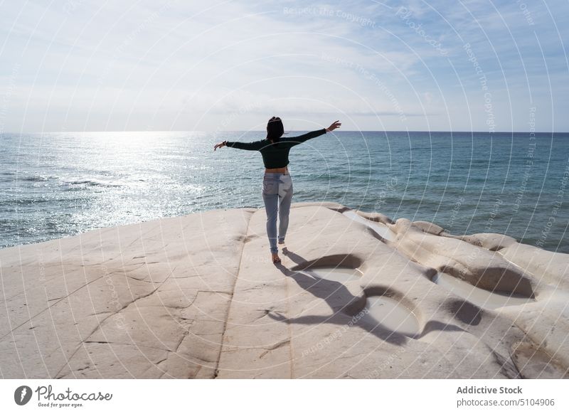 Woman walking on white rocky cliff near sea woman traveler ripple water journey tourism nature scala dei turchi agrigento sicily italy europe scenic picturesque