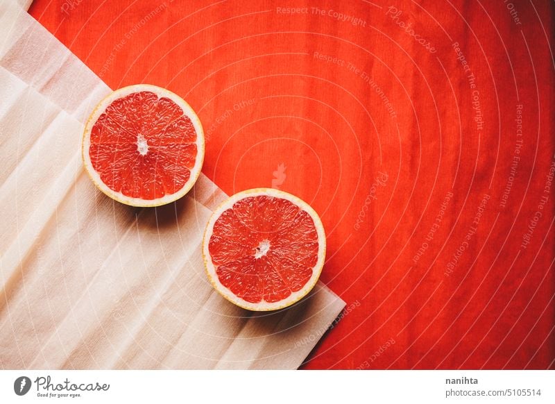 Colorful background in coral and red with fresh open grapefruit texture paper orange peach color juicy new citric healthy temptation vegan vibrant colorful