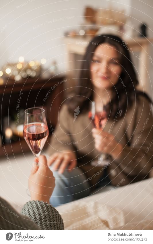 Couple drinking wine at home. Cheering with glasses of rose champagne. Celebrating holiday season. woman beautiful laptop happy red work girl celebration