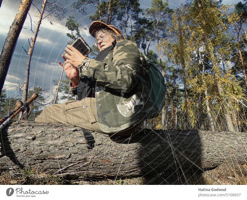 Walking in the forest. Walk in the forest. Resting on the tree trunk. Forest Hiking hikers Hiking trip Tree Tree trunk Forest walk Clearing Edge of the forest