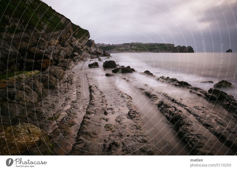 Liencres Beach Bad weather cliffs rock steep coast Stony coastline Bizkaia Sky Nature Ocean Landscape Spain Long exposure