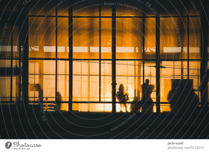 Glass facade in the evening sun from Alexanderplatz station Train station Glas facade Structures and shapes Silhouette Downtown Berlin Back-light evening light