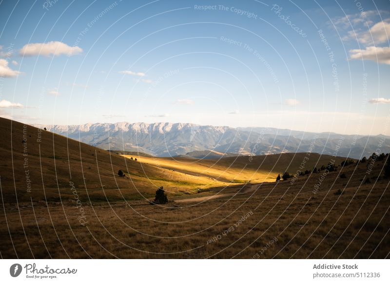 Mountain valley under blue cloudy sky scenery mountain ridge nature landscape grass highland environment harmony pyrenees europe untouched range slope