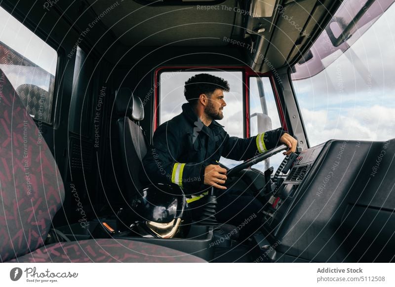 Hispanic fireman driving fire engine drive smile work emergency friendly uniform protect portrait male adult hispanic ethnic service positive professional job