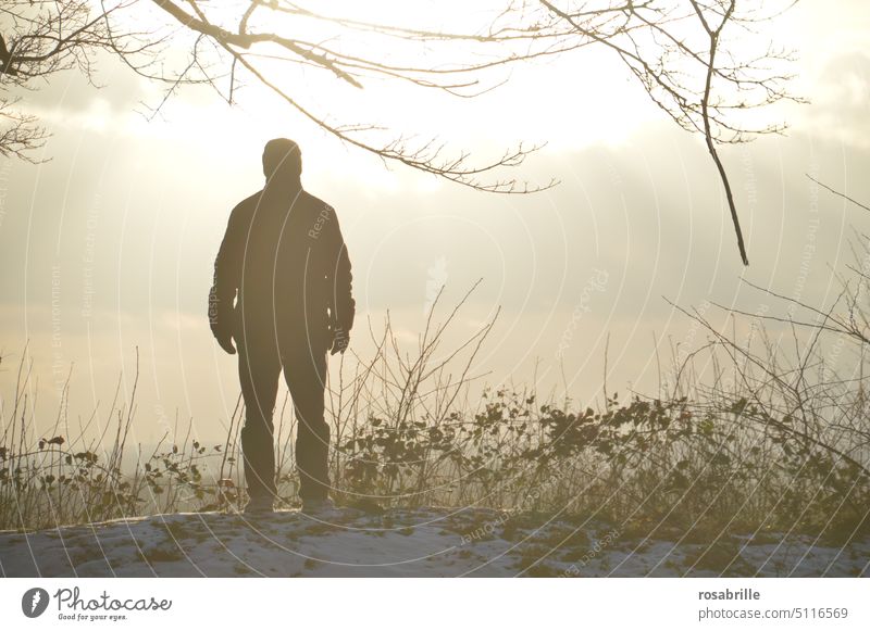 Far view: Silhouette of man in fog on snow | color reduced Fog Snow Man back view foggy Winter Cold hillside View into the distance Back-light hazy Haze wide