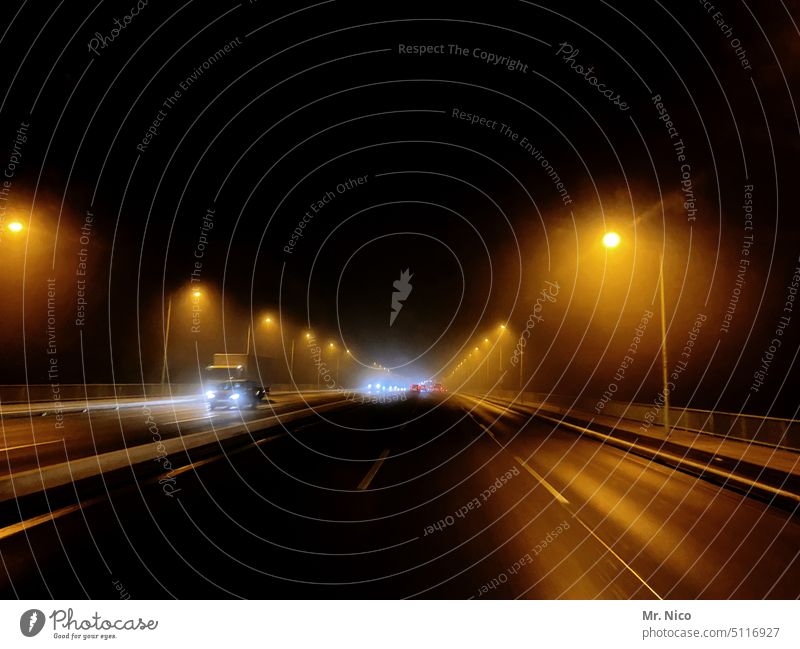 Urban highway with street lighting Night streets Street cars Car Truck Transport street lamps Light Highway Lighting Rush hour Logistics Mobility Multi-line