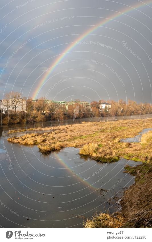 Rainbow passes over a district and is reflected in the water of the Old Elbe River Secondary rainbow Reflection in the water reflection old Elbe Town Quarter