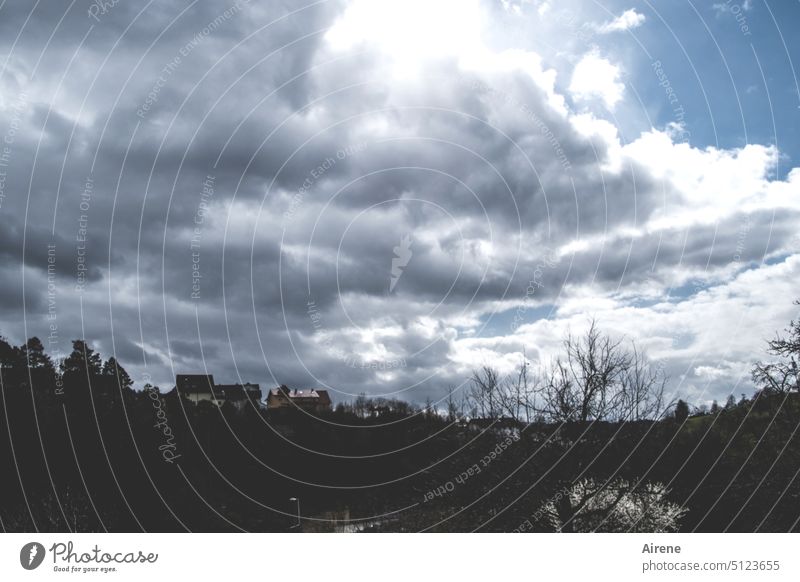 premonition Silhouette Clouds Storm clouds Elements Sky Dangerous Threat Shadow Subdued colour Long shot Cold Creepy Gloomy somber Hill Village Dark