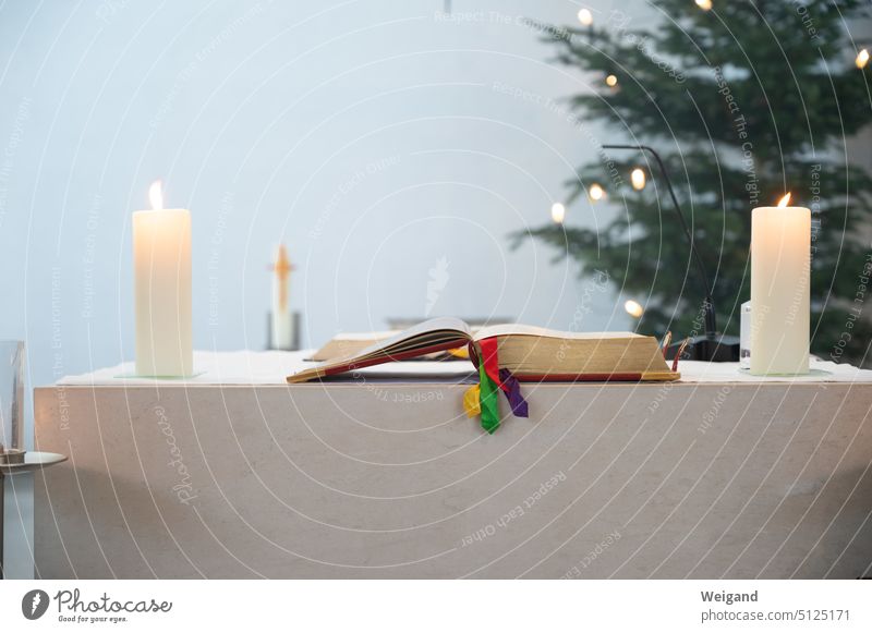 Altar with missal and candles in front of Christmas tree Church Belief liturgy Church service Catholic Christmas service Advent Christmas mass