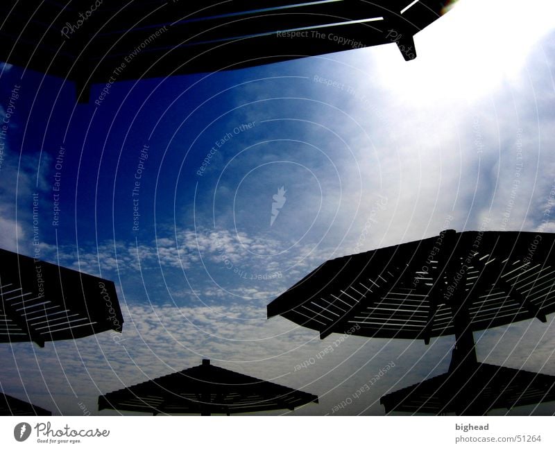 dark sunshades Sunshade UFO Summer Dark Clouds Beach Canopy Bathing place Sky Sunbathing Africa Coast Shadow Blue Contrast Nature