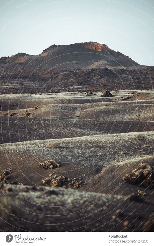 #A0# At the beginning Volcano crater Volcanic Volcanic crater Volcanic island volcanic rock Vulcanism volcanism volcanoes Canaries Lanzarote Landscape mightily