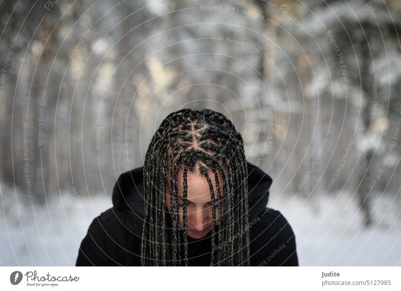 Young woman with African braids in natural winter environment landscape adult attractive beautiful beauty braided braided hairstyle candid carefree caucasian